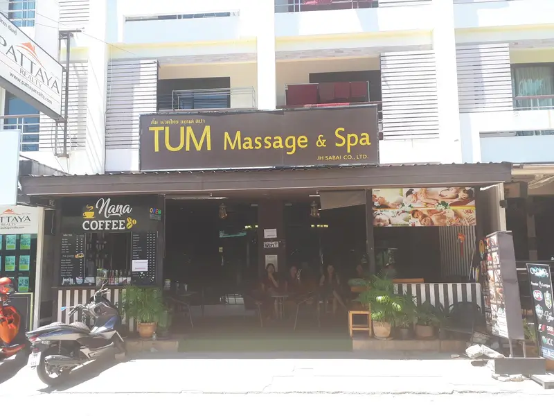The shop front with an earlier brown and yellow sign reading TUM Massage & Spa